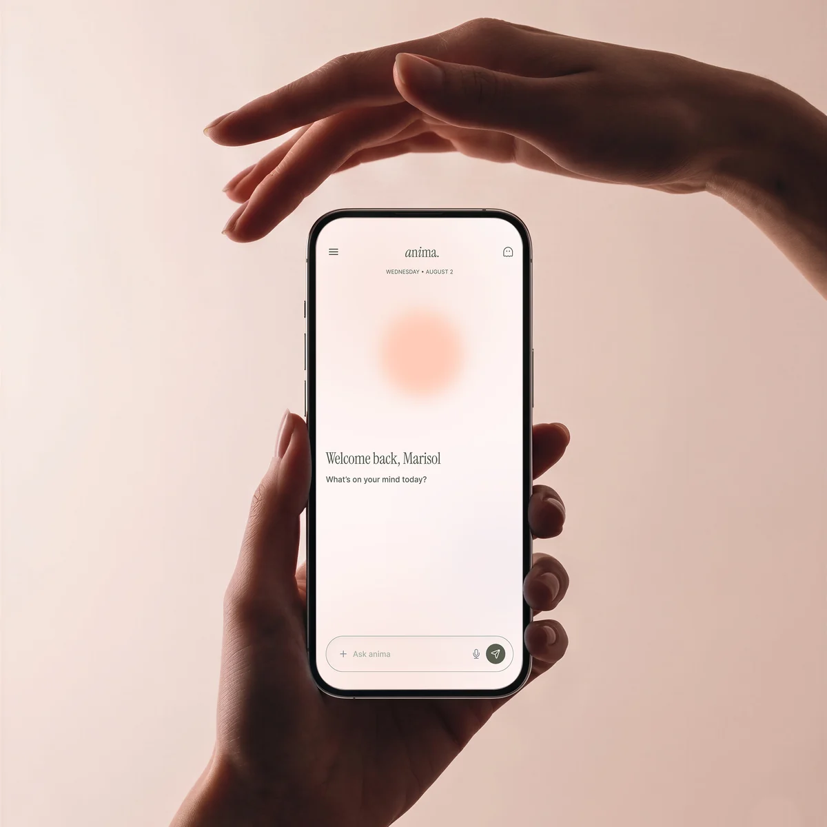 Anima app on a phone held between two hands